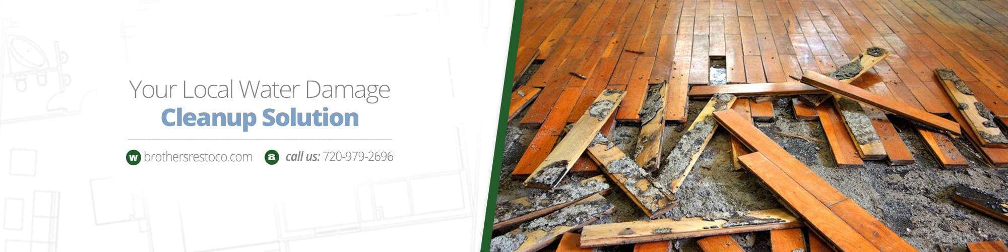Water-damaged hardwood floor with buckled boards torn up over a wet subfloor
